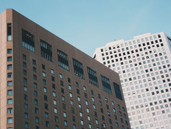 Low angle view of residential buildings against clear sky