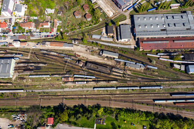 Aerial drone view of old locomotive train depo, parking iron horses on railway routes. diesel engine