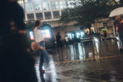 People in wet city