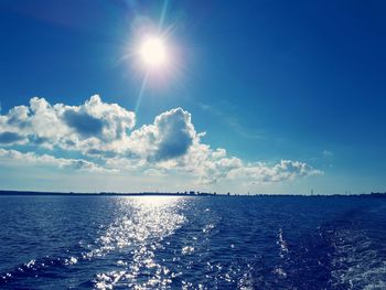 Scenic view of sea against blue sky