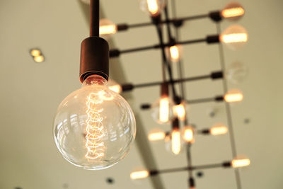 Low angle view of illuminated light bulb