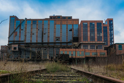 Train on railroad tracks against sky