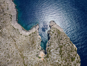 High angle view of rocks in sea