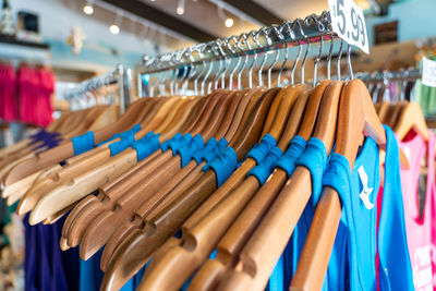 Close-up of clothes on rack in store