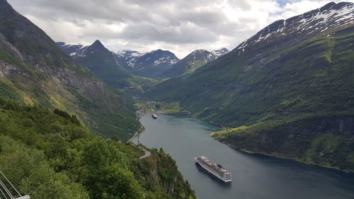 Scenic view of geirangerfjord amidst mountains
