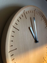 Close-up of clock on wall