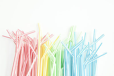 Close-up of multi colored pencils against white background