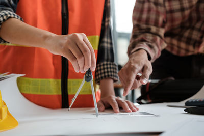 Midsection of man working at office