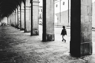 People walking on colonnade