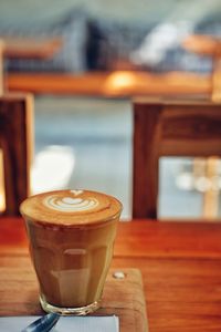 Close-up of coffee served on table at cafe