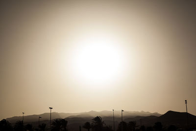 Scenic view of silhouette mountains against sky during sunset