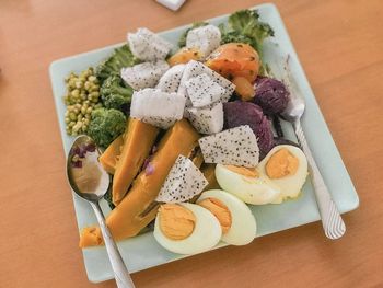 High angle view of vegetables in plate on table