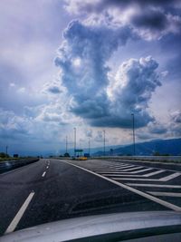 View of road against cloudy sky