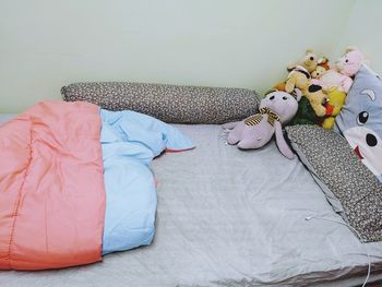 High angle view of stuffed toy on bed at home