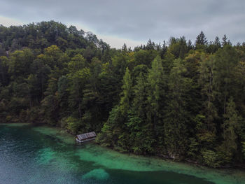 Amazing landscape of alpine lake with crystal clear green water and blue sky.