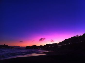 Scenic view of river against sky at dusk