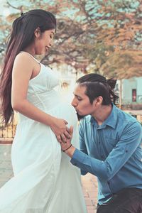 Young couple standing outdoors