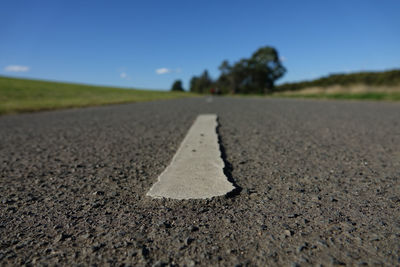 Surface level of road against the sky