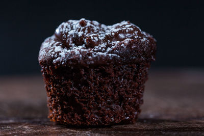 Close-up of ice cream cone against black background