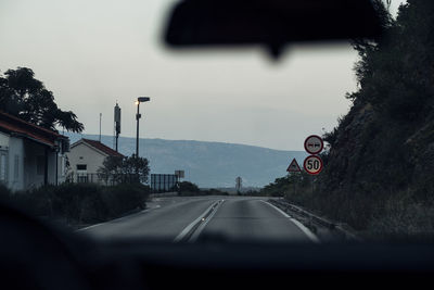 Road seen through car windshield