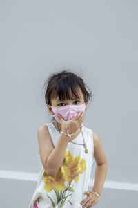 Portrait of girl wearing mask