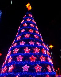 Illuminated christmas tree at night