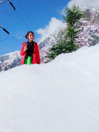 Full length of woman standing on snow