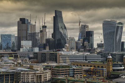 Modern buildings in city against sky