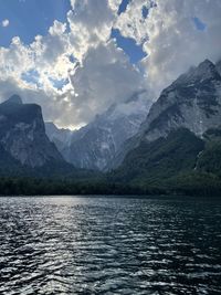 Scenic view of lake and mountains against sky