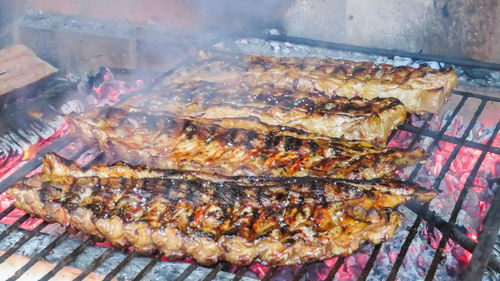 High angle view of fish on barbecue grill