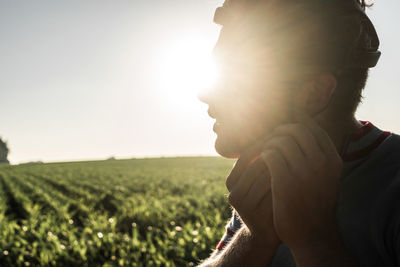Portrait of man on field against sky