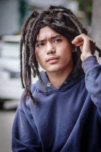 Portrait of young man standing outdoors