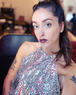 Portrait of beautiful young woman siting indoors