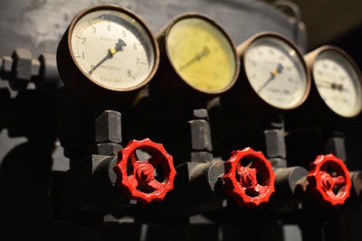 Close-up of illuminated clock in factory