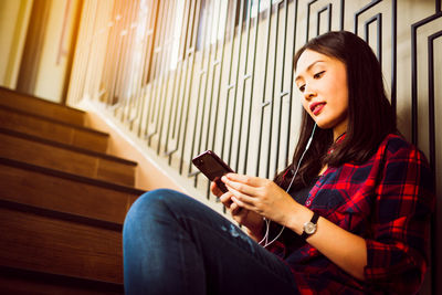 Young woman using mobile phone