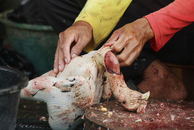 Midsection of man preparing food