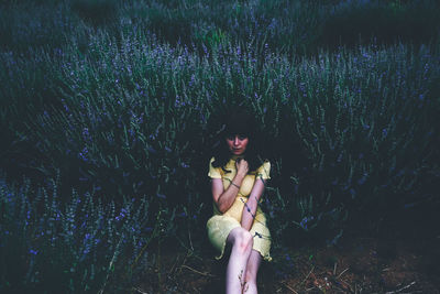 Portrait of woman on purple flower field