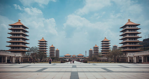 Buildings in city against sky