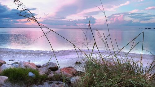 Scenic view of sea against cloudy sky