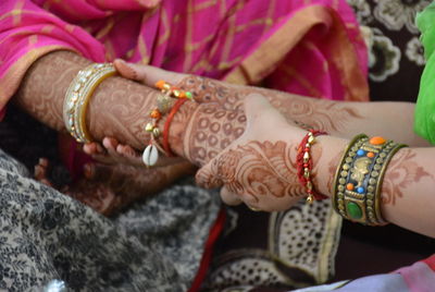 Close-up of couple holding hands