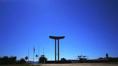 Windmills against clear blue sky