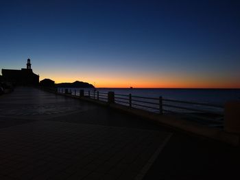 Scenic view of sea against clear sky during sunset