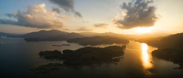 Scenic view of lake against sky during sunset