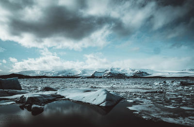 Scenic view of frozen lake against sky