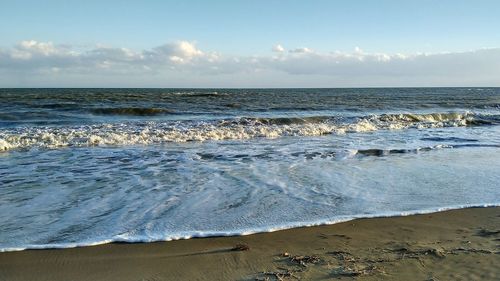 Scenic view of beach against sky