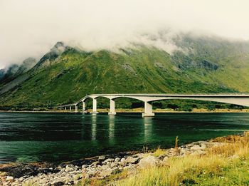 Bridge over river against sky