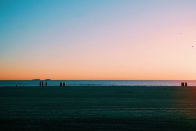 Scenic view of sea against clear sky during sunset