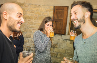 Young couple in a drinking glass