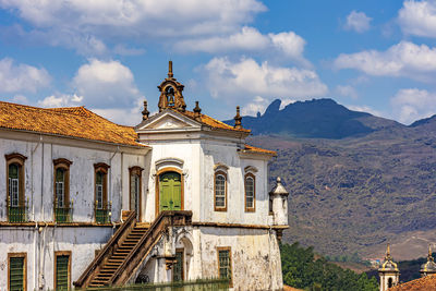 Ancient baroque church in the city of ouro preto with the hills