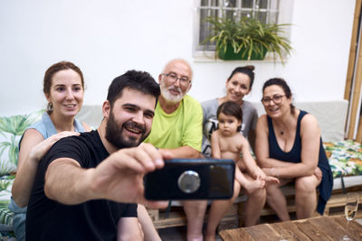 A family reunited by becoming a selfie together. concept family